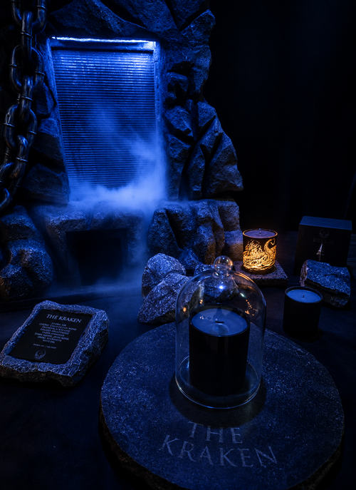 THE KRAKEN scented candle in a dark ocean-inspired setting